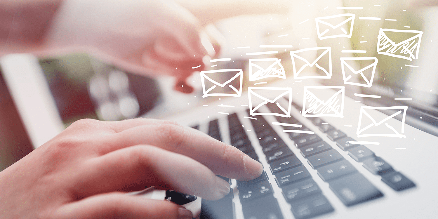 Close up of a person typing on a computer keyboard, illustrating the concept of using a business email address