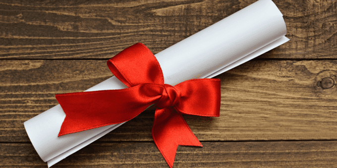 Image of a white document rolled up and tied with a bow, representing a Certificate of Good Standing.
