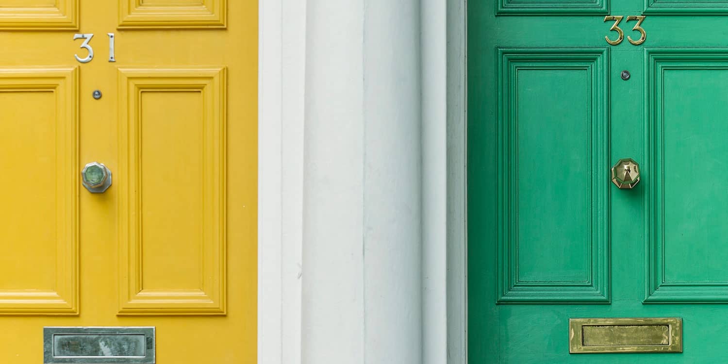 A yellow door marked 31 next to a lime green door marked 33