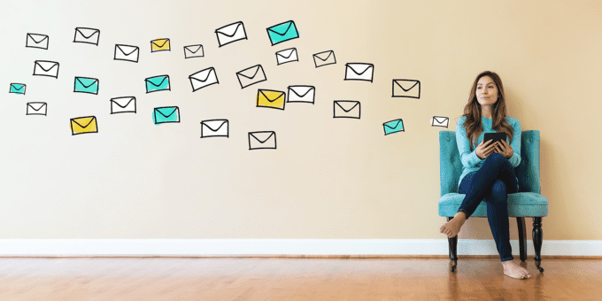 mail flying next to sitting woman