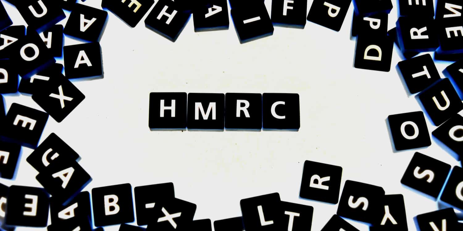 Four black tiles with white letters displaying the abbreviation "HMRC".