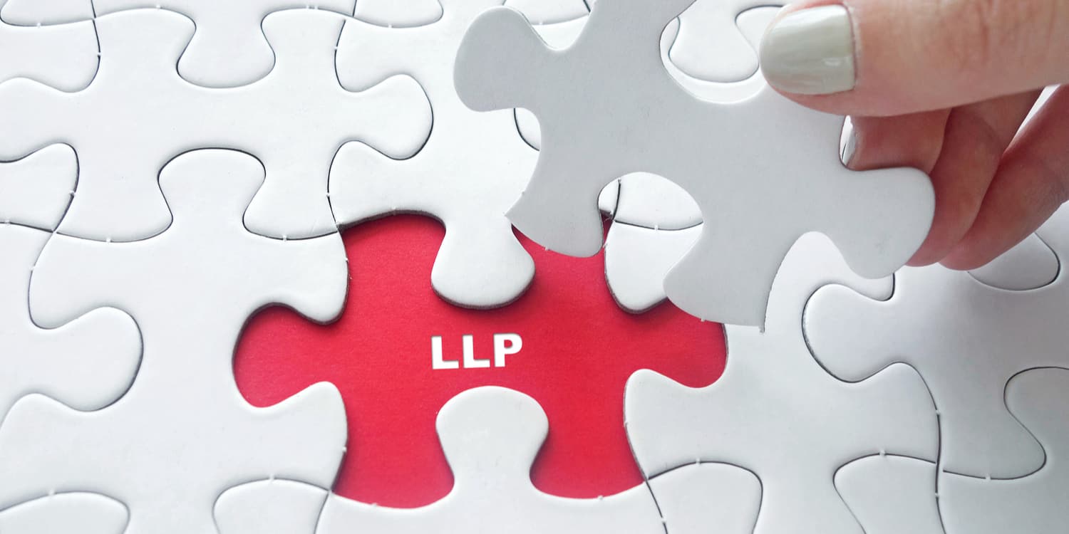 Red jigsaw piece with 'LLP' in white font.