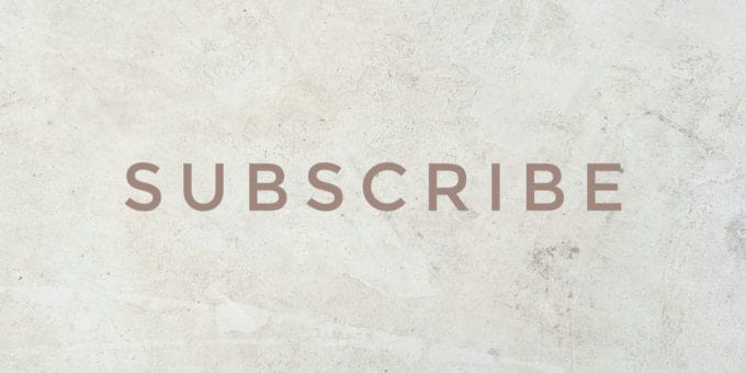 The word 'SUBSCRIBE' in capital letters and beige font colour against a marbled background.