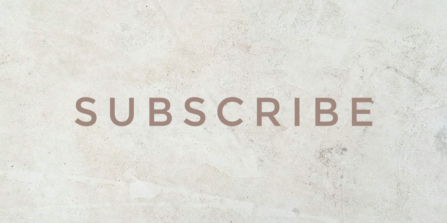 The word 'SUBSCRIBE' in capital letters and beige font colour against a marbled background.