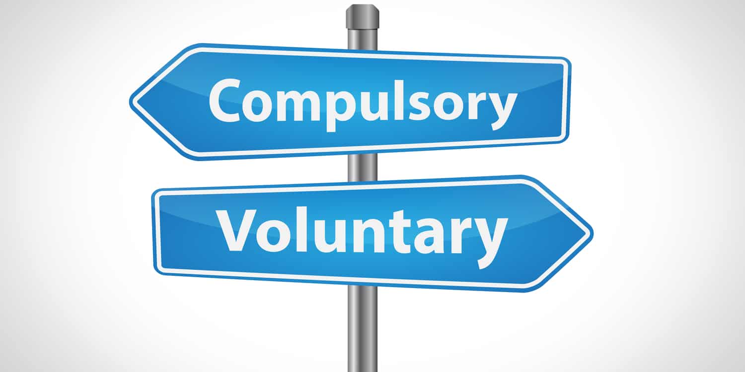 Two directional street signs displaying the words 'Compulsory' and 'Voluntary' - in white text with light blue background.