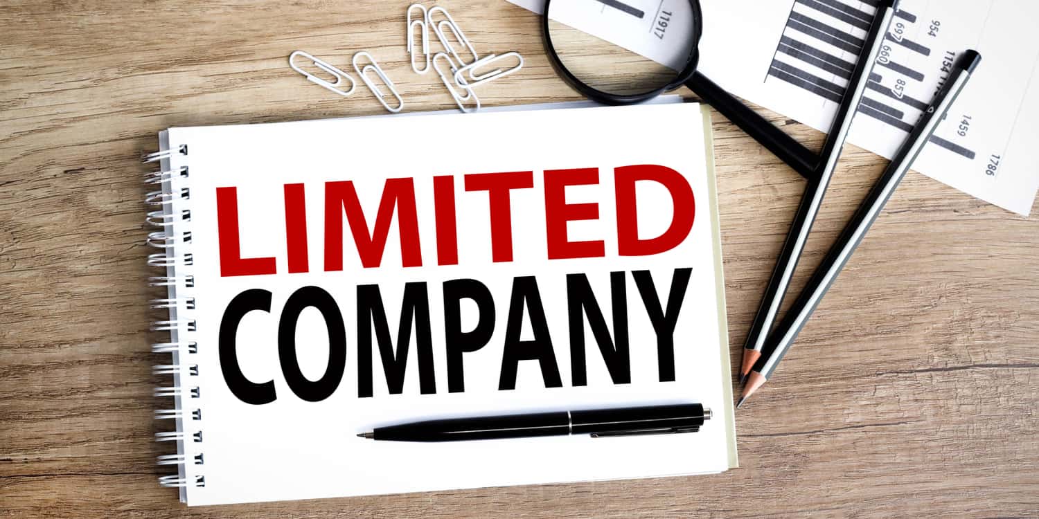 Limited company. text written on white notepad paper on wood background