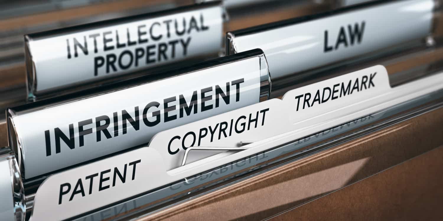 Illustration of filing tabs labelled Intellectual property, infringement, patent, copyright and trademark.