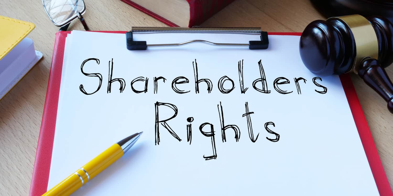 'Shareholders Rights' wrtten on a sheet of white paper held within a red clipboard.