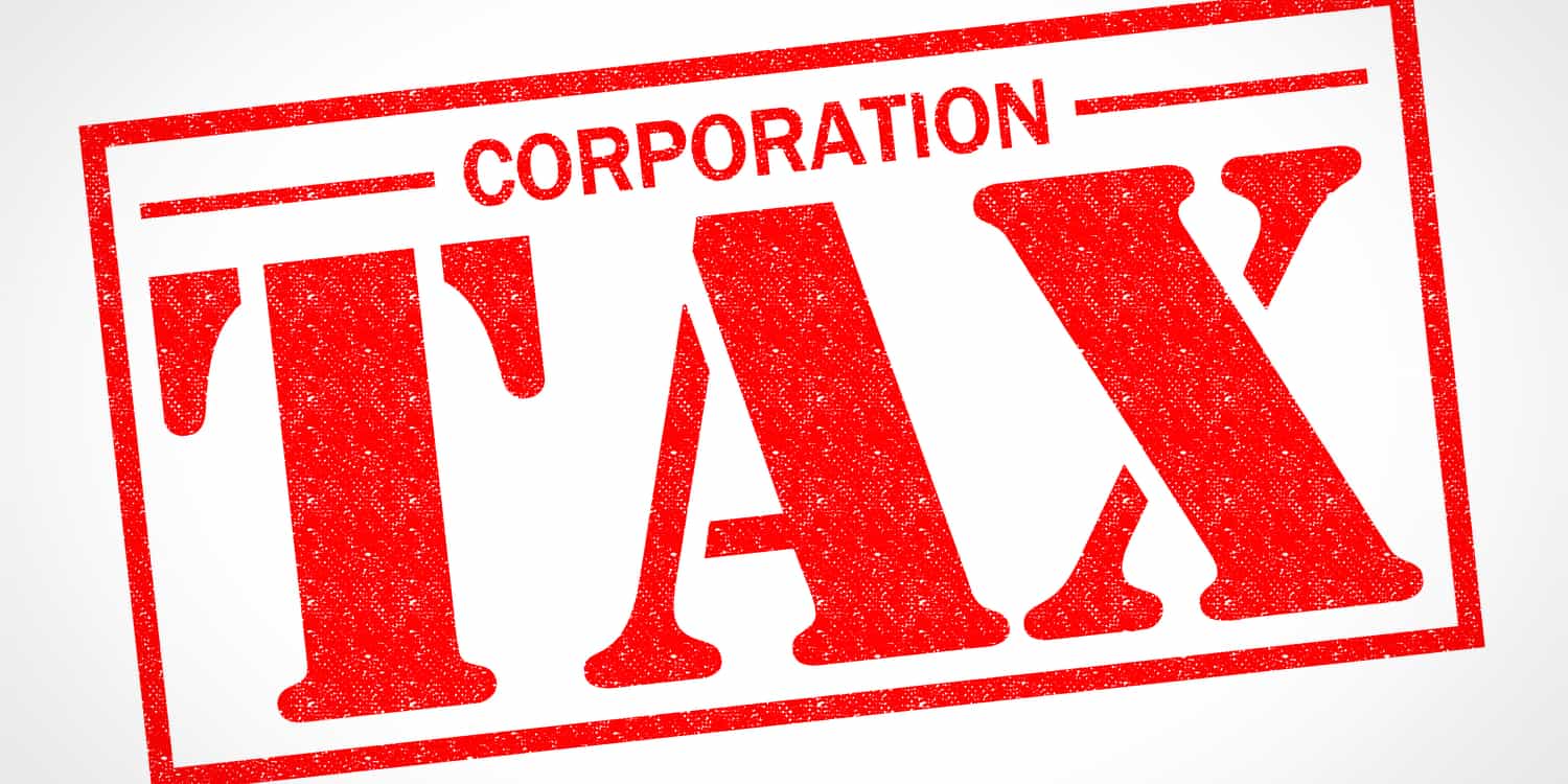 CORPORATION TAX red rubber stamp over a white background.