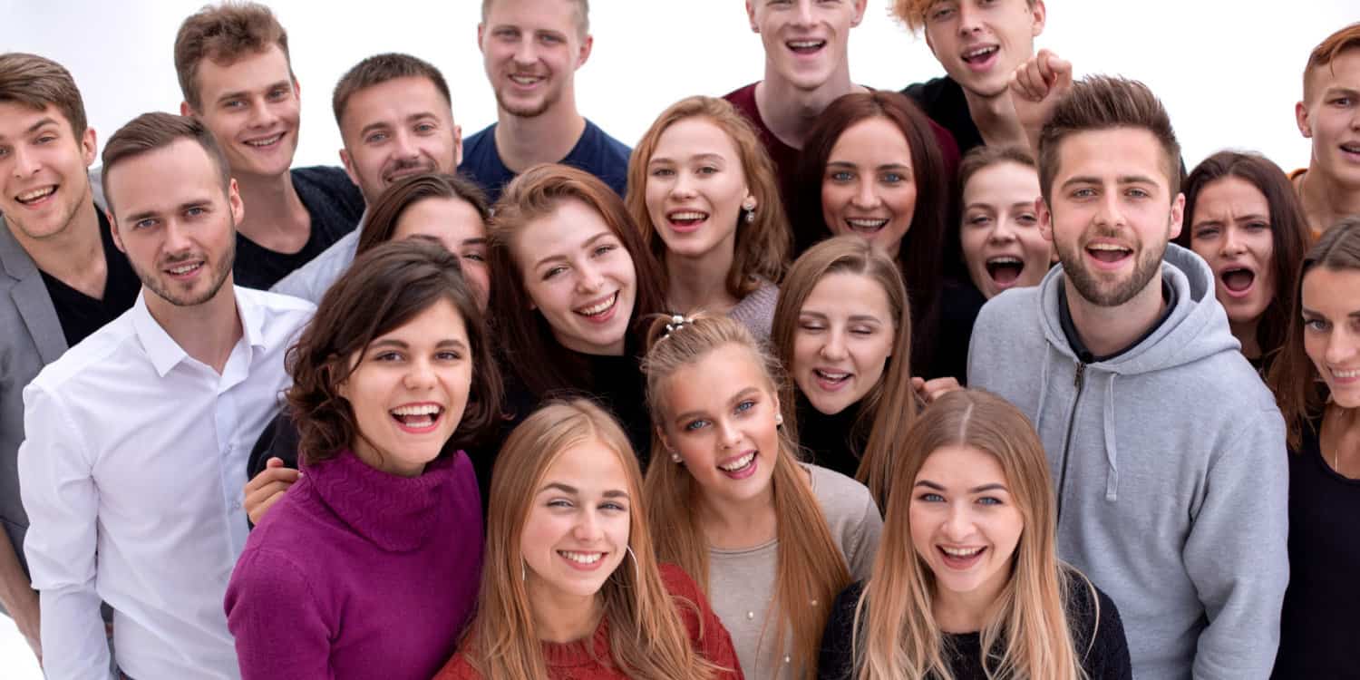 Portrait of members of a community interest company smiling at the camera.