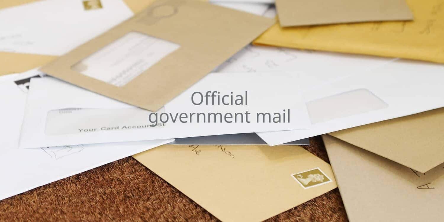 A pile of mail on a doormat with the heading 'official government mail'