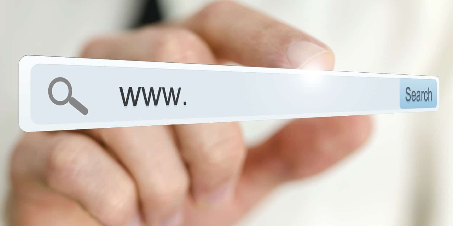 hand holding a browser search bar with 'www.' written