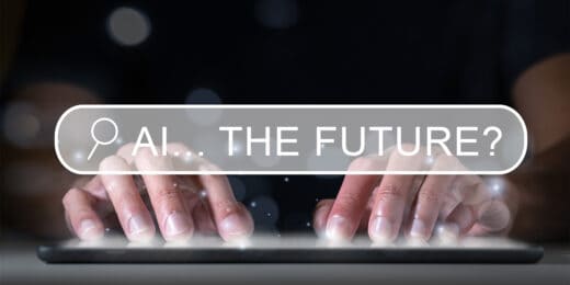 Image of hands typing on a keyboard with a search box overlay, with 'AI... THE FUTURE?' showing as the text in the search box
