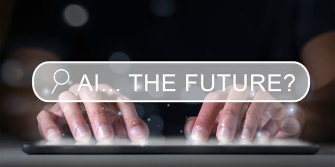 Image of hands typing on a keyboard with a search box overlay, with 'AI... THE FUTURE?' showing as the text in the search box