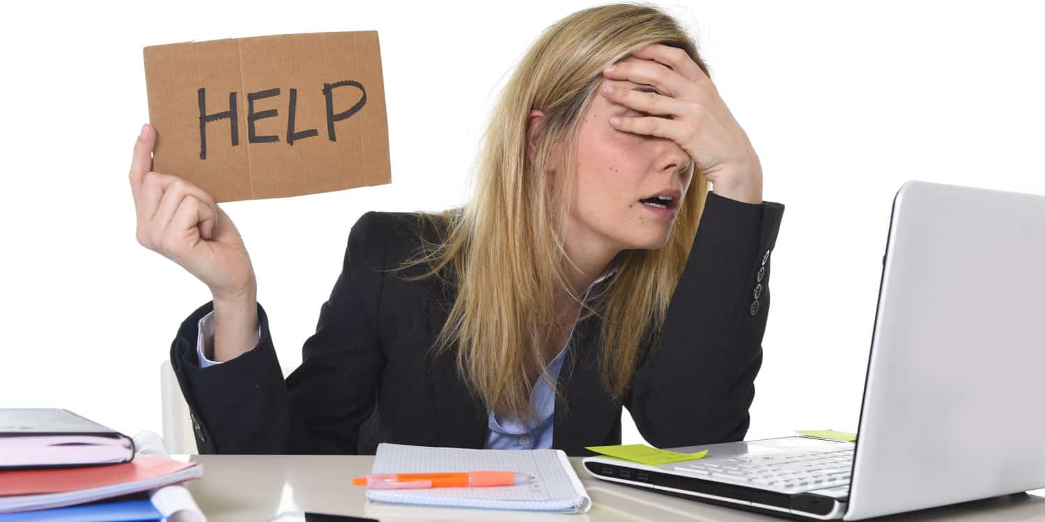 Young business woman suffering stress working at home-office in remote meeting asking for help feeling tired and frustrated.