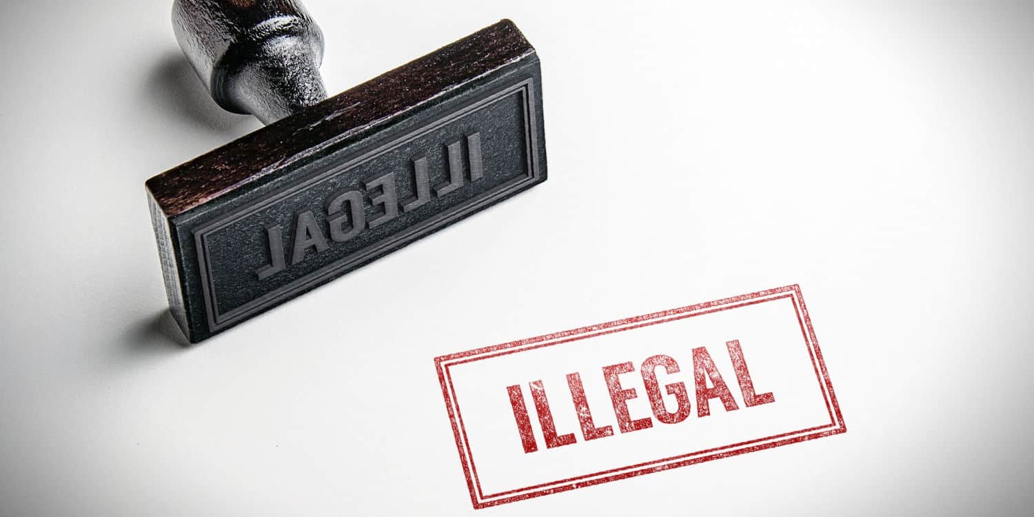 Rubber stamp that says 'Illegal'.