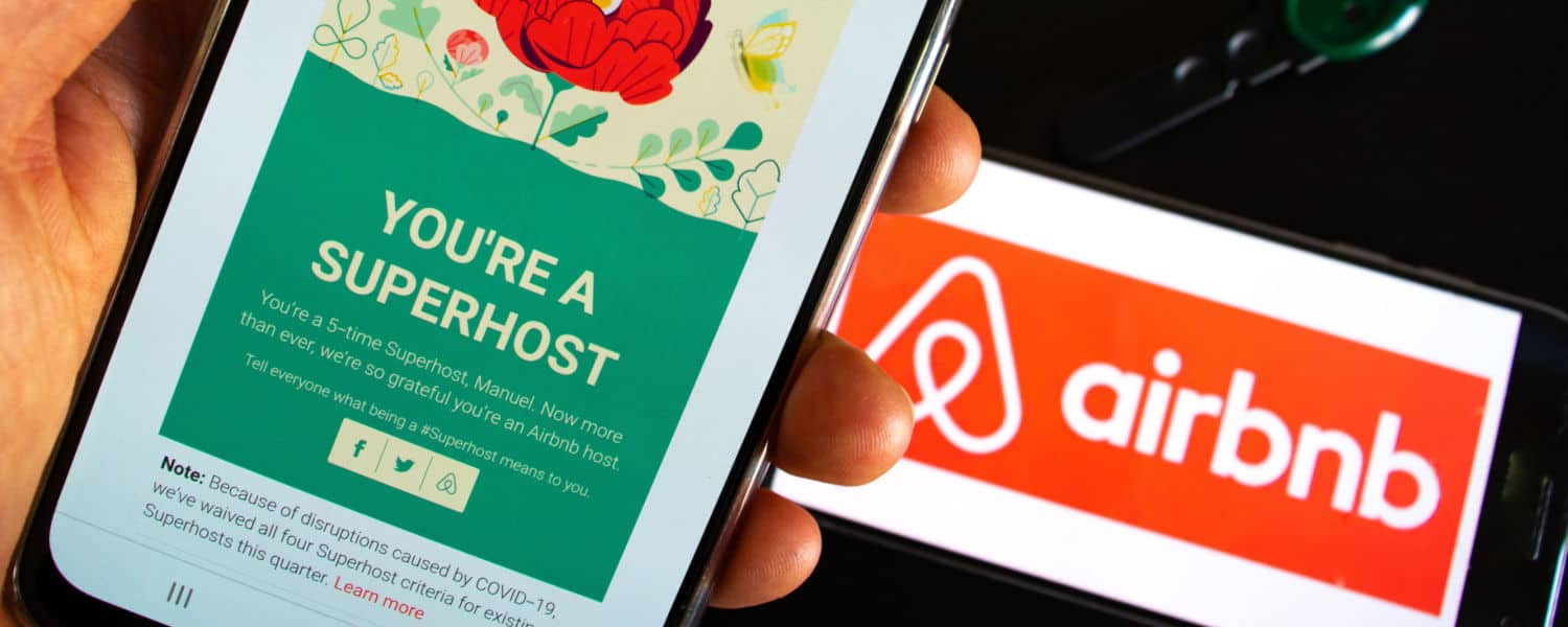 An Airbnb host is receiving the notification of their superhost program reward by the Airbnb portal. This certifies their hospitality to a guest or a tourist