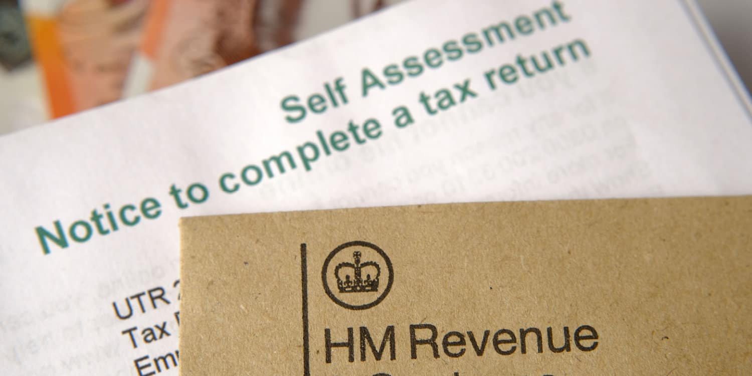HM Revenue and Customs (HMRC) brown envelope and blurred Self Assessment and tax return notice letter.