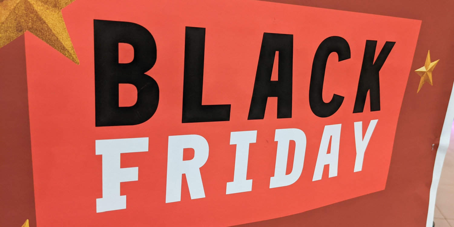 BLACK FRIDAY text in black and white font colours on red sign.