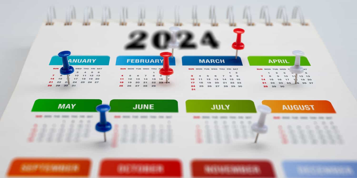 2024 calendar planner with colourful pins marking key dates for business owners in 2024.