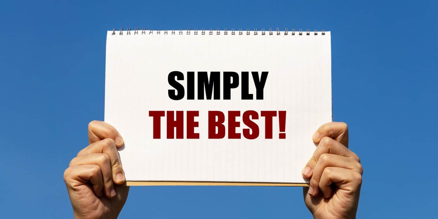 SIMPLY THE BEST text printed on a notebook held by 2 hands with isolated blue sky background. This message reinforces the concept of the All Inclusive Package being the best way to form a limited company.