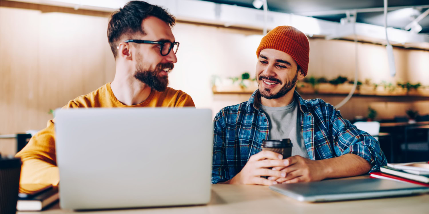 Professionals reviewing data on a screen, showing the role of AI in entrepreneurship.