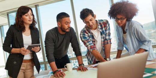 Team of professionals collaborating on a business project in modern office