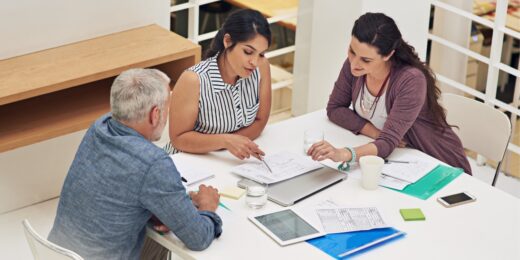 Small business team conducting market research and reviewing data together