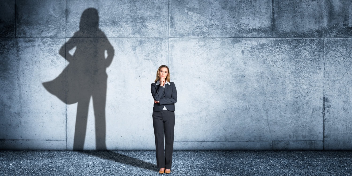 Female director with a superhero shadow behind her