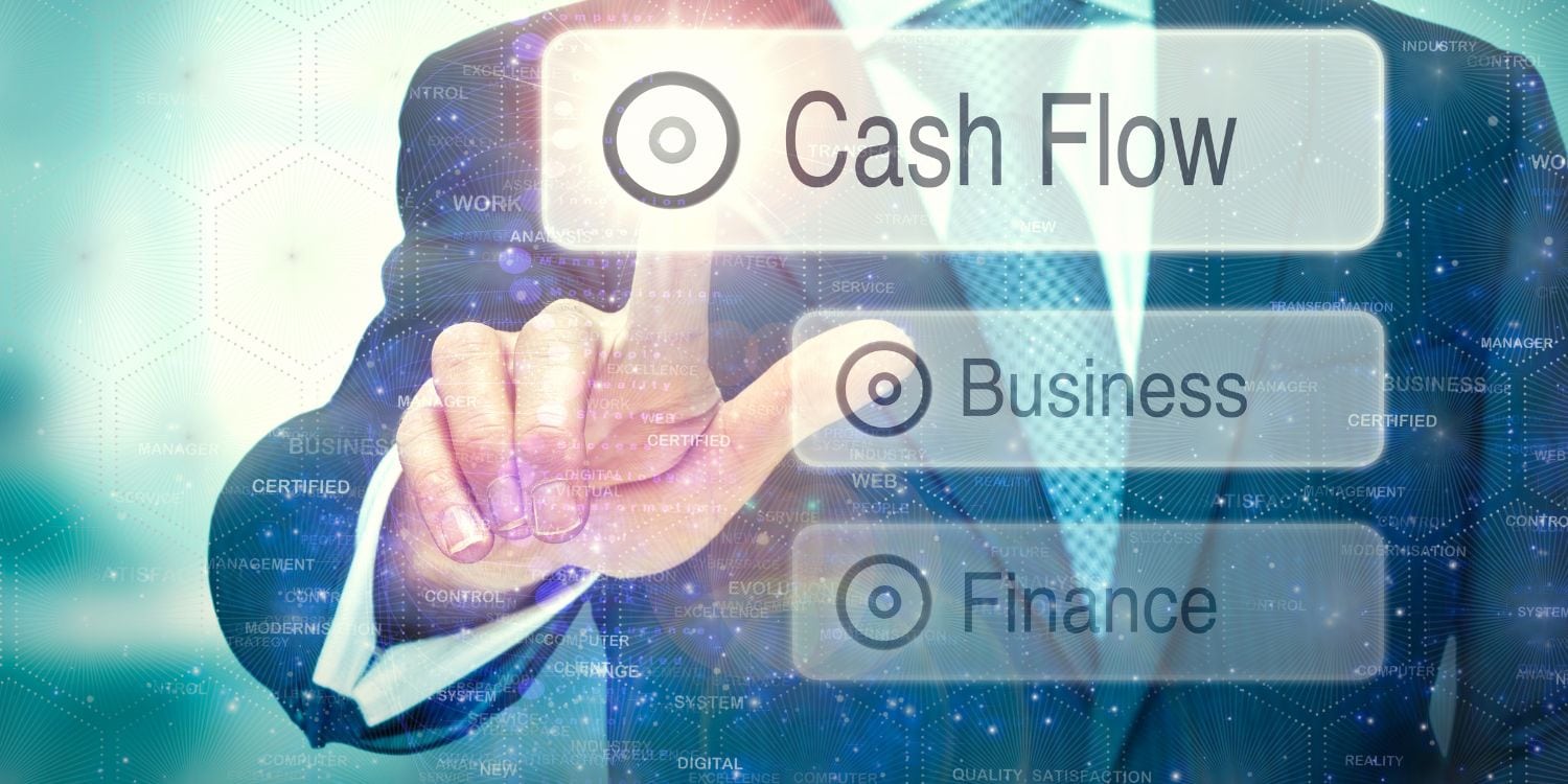 Three floating boxes that say finance, business, and cash flow within each. A an in a suit is pointing at the 'cash flow' box.