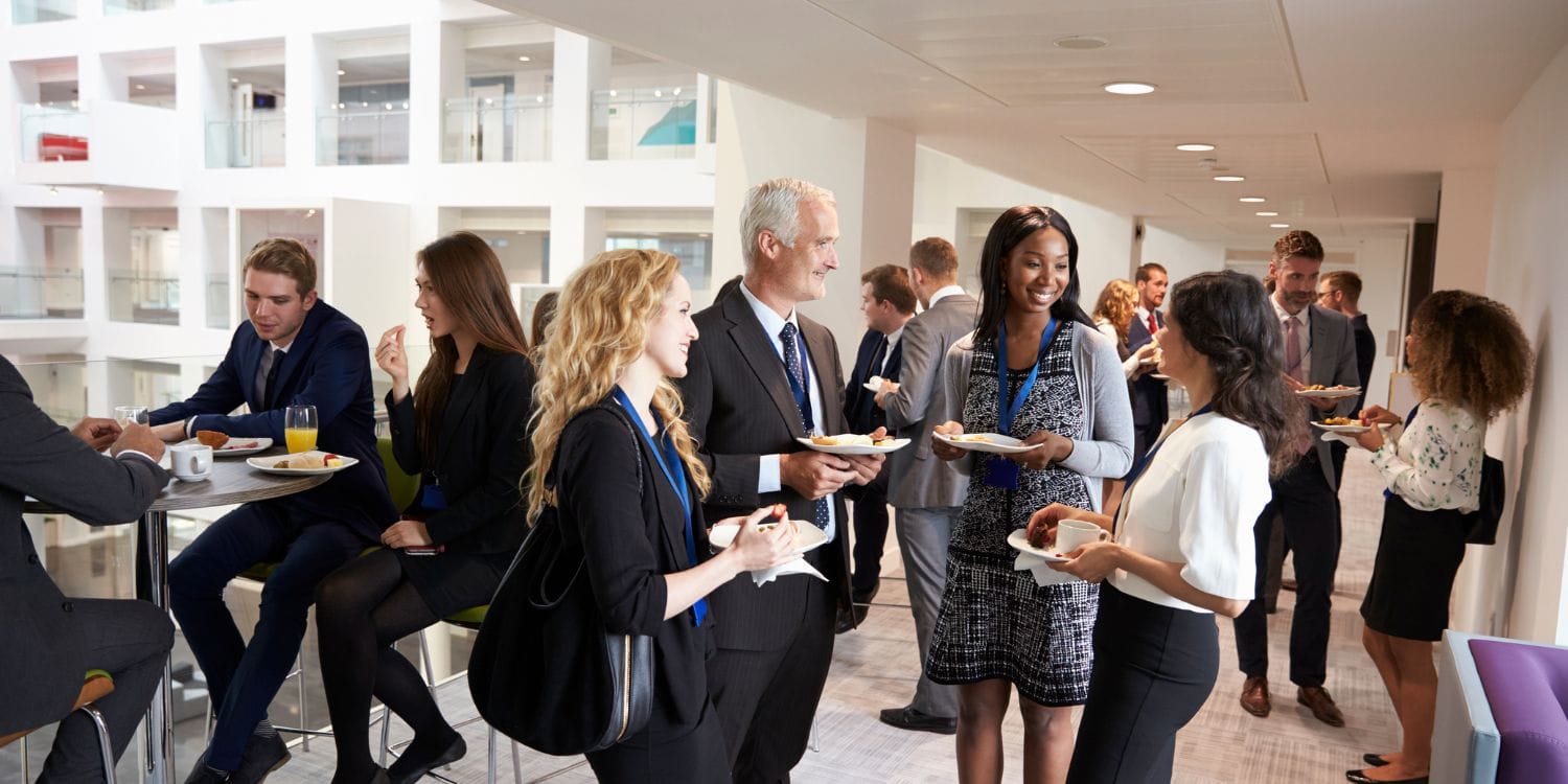 A room full of business people at a networking event.